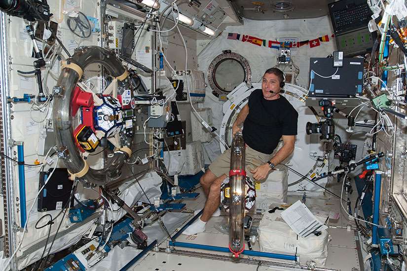 Astronaut Mike Hopkins works with a pair of free-flying satellites in the International Space Station&#039;s Kibo laboratory Nov. 4, 2013. Hopkins was able to observe his Catholic faith through prayer and taking holy Communion throughout his flight. 