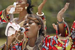 A woman sings during an Easter service in Nairobi, Kenya,i April 5 for the victims of the massacre at Garissa University College. Al-Shabaab militants raided the campus April 2, leaving 148 dead. 