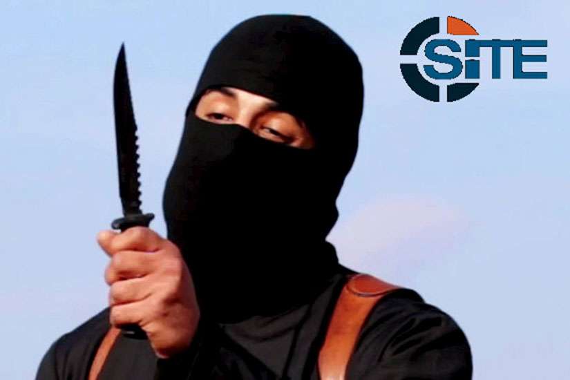 A masked, black-clad militant, identified as a Briton named Mohammed Emwazi, brandishes a knife in this still image from a 2014 video. Cardinal Vincent Nichols of Westminster planned to tell delegates at a London conference Jan. 28 to guard against the Internet recruitment of vulnerable secondary school students by the Islamic State group.