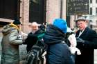 Cardinal Timothy M. Dolan of New York hands out sandwiches at the St. Francis of Assisi Church Breadline in New York following a Feb. 18 Ash Wednesday Mass.