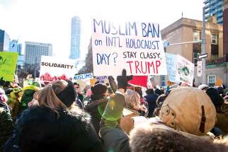 Protesters gather in Toronto to protest the American ban on refugees and migrants from seven predominantly Muslim nations.