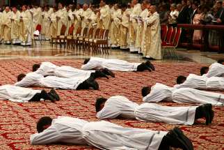 Priests lie prostrate during their ordination by Pope Francis during a Mass in St. Peter&#039;s Basilica at the Vatican April 22.