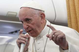 Pope Francis speaks to journalists aboard his flight from Cairo to Rome April 29.