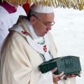 Pope Francis holds a bronze reliquary containing the relics of St. Peter the Apostle on the altar during a Mass in St. Peter&#039;s Square at the Vatican Nov. 24. The bone fragments, which were discovered during excavations of the necropolis under St. Peter&#039;s Basilica in the 1940s, are kept in the pope&#039;s private chapel but had never been displayed in public.