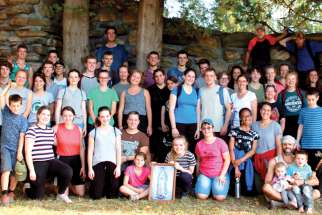 A group gathers after completing the annual Wilno Pilgrimage.