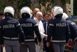 Pope Francis greets police officers before entering the Vatican after being discharged from Rome&#039;s Gemelli hospital following his recovery from colon surgery in this screengrab taken from a video July 14, 2021.