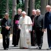 Pope Benedict XVI walks with Vatican officials and other clergy during a visit to the Society of the Divine Word&#039;s Ad Gentes center in the village of Nemi, Italy, July 9. 