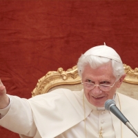 Pope Benedict XVI waves as he leads his weekly general audience at his summer residence in Castel Gandolfo, Italy, Aug. 17.