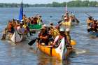 Jesuit and indigenous pilgrims arriving in Kahnawake on August 15, an Indian reserve in Montreal. They reach the end of their 540-mile canoe trip, following a route used by 17th-century missionaries, in an effort to promote reconciliation.