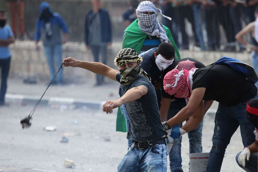 Palestinian protesters clash with Israeli soldiers in Bethlehem, West Bank, Oct. 6. Violence in Israel and the West Bank has increased in October