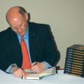 Author and journalist Michael Coren signs copies of his new book Heresy at a recent book launch.