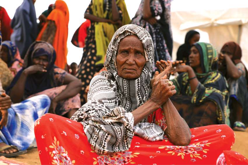 An internally displaced Ethiopian woman waits to receive food aid at the Higlo camp in Gode April 26. Catholic bishops in Ethiopia have expressed deep sadness at the resumption of fighting in the north of the country while urging parties to prioritize peace.