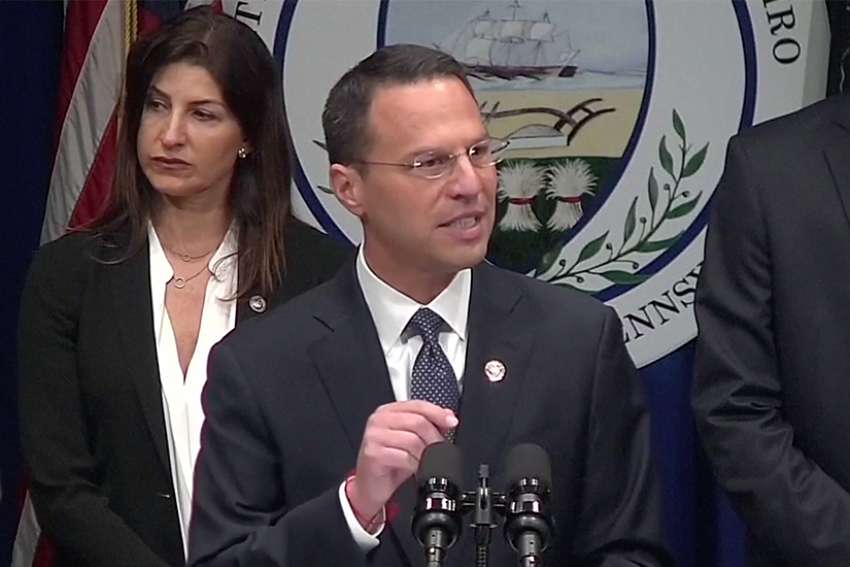 In a screen grab taken from video, Pennsylvania Attorney General Josh Shapiro speaks during an Aug. 14 news conference to release a grand jury on a months-long investigation into abuse claims spanning a 70-year period in the dioceses of Harrisburg, Pittsburgh, Scranton, Allentown, Greensburg and Erie.
