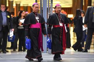 Chinese Bishops Joseph Guo Jincai of Chengde and Coadjutor Bishop John Baptist Yang Xiaoting of Yan&#039;an depart the opening session of the Synod of Bishops on young people, the faith and vocational discernment at the Vatican Oct 3. 