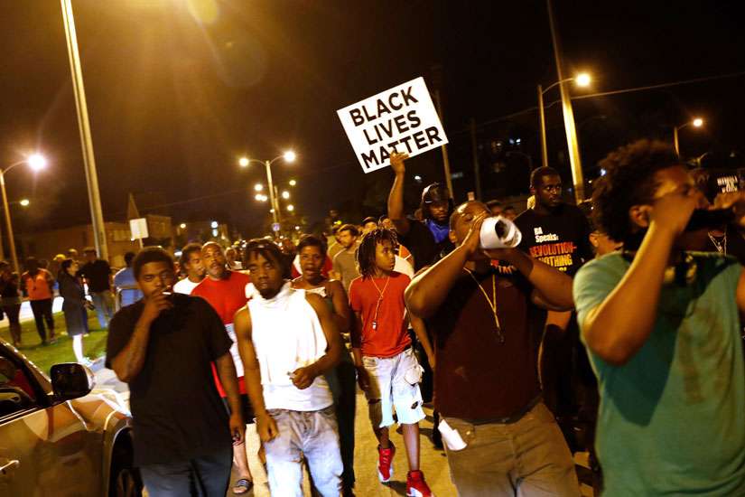 Protestors march Aug. 15 following the police shooting of a man in Milwaukee the previous day.