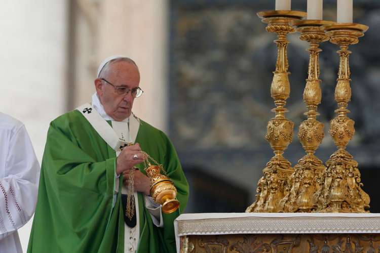Pope Francis burns incense as he celebrates a Mass for the sick and disabled in St. Peter&#039;s Square at the Vatican June 12. The Mass was an event of the Jubilee of Mercy.