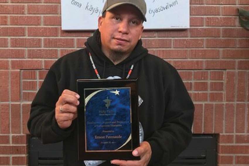 Ernest Patenaude with his Excellence in Indigenous Education Award.