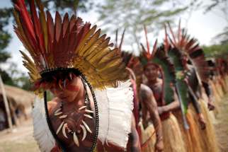 Shanenawa people dance during a festival to celebrate nature and ask for an end to the burning of the Amazon, in the indigenous village of Morada Nova near Feijo, Brazil.