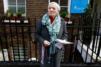 A woman prays the rosary in 2012 outside the Marie Stopes clinic in London. Members of Ealing Council, in the west of the capital, voted April 10 to establish a buffer zone around a Maria Stopes clinic, banning public prayer and offers of assistance to women within 100 meters of the building.