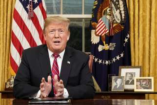  U.S. President Donald Trump delivers an address Jan. 8 televised to the nation from his desk in the Oval Office at the White House in Washington. He spoke about immigration and the southern U.S. border on the 18th day of a partial government shutdown.
