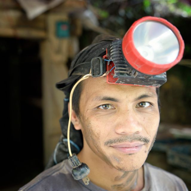 A gold miner stands outside a mine tunnel June 6 in Pamintaran, Philippines, a remote gold mining community near Maragusan on the island of Mindanao in southern Philippines. The site has become a focal point of an international struggle between small min ing operations and large international mining corporations.