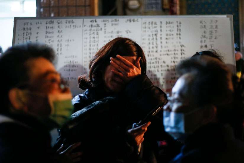A woman reacts as rescuers search for survivors Feb. 7 after a magnitude-6.4 magnitude earthquake in Tainan, Taiwan, the previous day. Pope Francis sent condolences following the quake that hit as the island prepared to celebrate Chinese New Year.