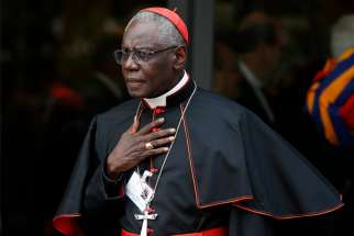Cardinal Robert Sarah, prefect of the Congregation for Divine Worship and the Sacraments, leaves a session of the Synod of Bishops on young people, the faith and vocational discernment is pictured at the Vatican in this Oct. 5, 2018, file photo.