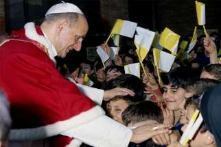 Pope Paul VI greets children as he visits the Church of St. Leo the Great in Rome March 31, 1968. 