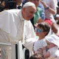 Pope Francis greets a boy as he arrives to lead his general audience in St. Peter&#039;s Square at the Vatican May 1.