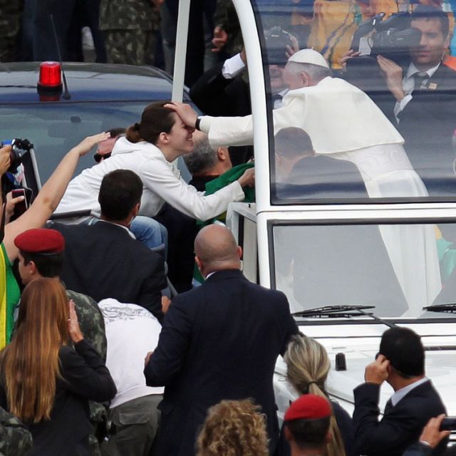 Pope Francis blesses a woman in a wheelchair as he arrives for the closing Mass of World Youth Day in Rio de Janeiro July 28.