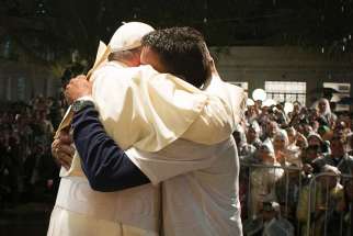 Pope Francis embraces a patient at St. Francis of Assisi Hospital, where the pontiff addressed a group of recovering drug addicts, offering them a message of compassion and hope, in this picture dated July 24, 2014 in Rio de Janeiro.