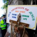 A sign with a crucifix and rosary are seen during a pro-life demonstration July 10 outside the Irish Parliament in Dublin ahead of a vote to allow limited abortion in Ireland. President Michael D. Higgins signed the Protection of Life During Pregnancy Bi ll into law July 30.
