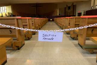 A sign reads &quot;closed section&quot; at St.-Benoît-Abbé&#039;s church in Quebec City Oct. 17, 2020, during the COVID-19 pandemic. The Quebec government announced Jan. 6 that places of worship will be completely closed from Jan. 9 to Feb. 8, 2021, during the pandemic.