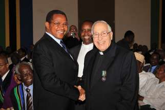 Br. Anthony Canterucci, right, receives Tanzania’s Medal of Honour from President Jakaya Kikwete.