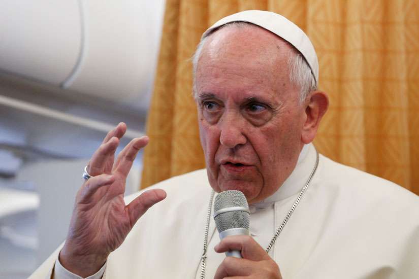 Pope Francis answers questions from journalists aboard his flight from Yerevan, Armenia, to Rome June 26. The Pope said during his in-flight press conference that the church should apologize to gays