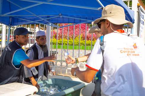 Muslims from Jumma Mosque in Panama City hand out complimentary cold bottles of water to World Youth Day pilgrims waiting to get into a welcoming ceremony with Pope Francis Jan. 24, 2019