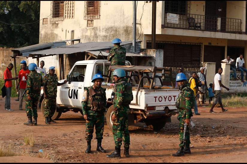U.N. peacekeepers patrol the street leading 