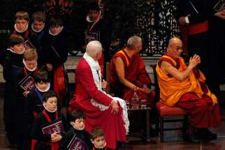The Dalai Lama, exiled spiritual leader of Tibet, right, attends the Templeton Prize ceremony during his first visit to St. Paul&#039;s Cathedral in London May 14, 2012.