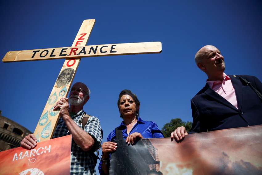 Advocates of zero tolerence for clergy sexual abuse including Peter Isely, right, Tim Law, and Denise Buchanan, attend a march with survivors of clergy sexual abuse and activists near the Vatican in Rome Sept. 27, 2023.