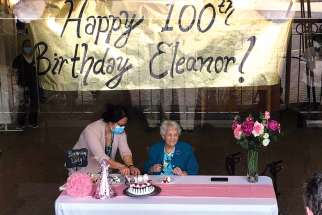 Eleanor Murphy had to keep a pane of glass between her and her family for her 100th birthday.