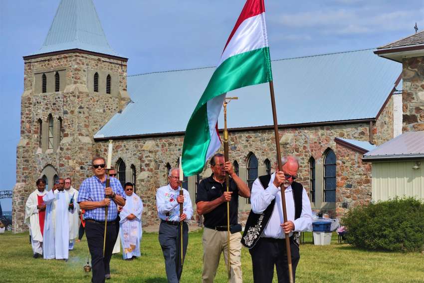 The Hungarian flag honours pioneers in the procession at the Kaposvar Pilgrimage.