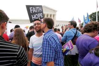 Gay rights supporters celebrate after the U.S. Supreme Court ruled that the U.S. Constitution gives same-sex couples the right to marry.