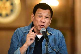 Philippine President Rodrigo Duterte announces the disbandment of police operations against illegal drugs Jan. 30 in Manila. The case filed against Duterte before the International Criminal Court in The Hague is a &quot;very good step&quot; toward stopping drug-related killings, a Catholic bishop said.