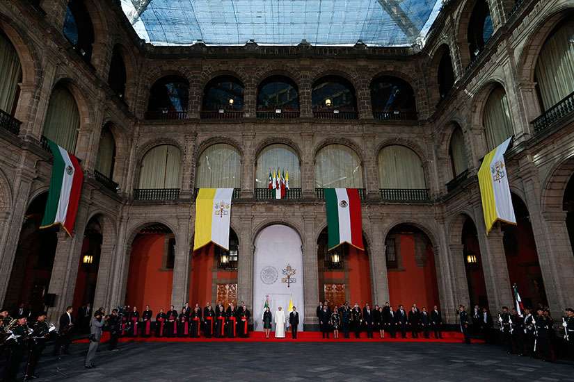 Pope Francis attends a welcoming ceremony with Mexican President Enrique Pena Nieto and first lady Angelica Rivera at the National Palace in Mexico City Feb. 13.