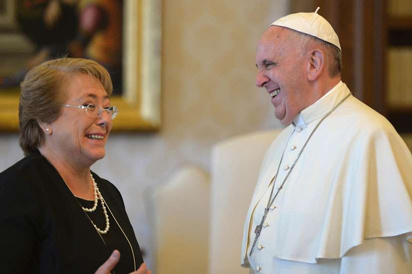 Pope Francis and Chilean President Michelle Bachelet laugh during a private audience at the Vatican June 5.