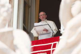 Pope Francis leads the Angelus from the window of his studio overlooking St. Peter&#039;s Square at the Vatican Sept. 18.