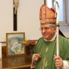 Cardinal Thomas Collins of Toronto leaves the sacristy to celebrate Mass as he takes possession of his titular church of St. Patrick in Rome Oct. 23. 