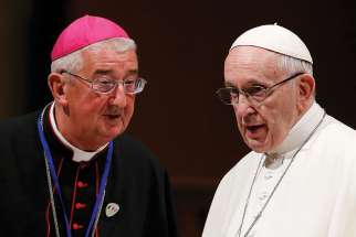 Pope Francis talks with Archbishop Diarmuid Martin of Dublin as he visits St. Mary&#039;s Pro-Cathedral in Dublin Aug. 25.