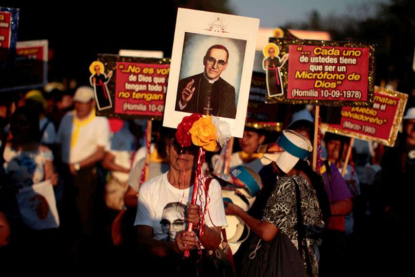 An image of Blessed Oscar Romero is seen during a March 26 procession in San Salvador, El Salvador, to commemorate the 37th anniversary of the March 24, 1980, murder of the archbishop. 