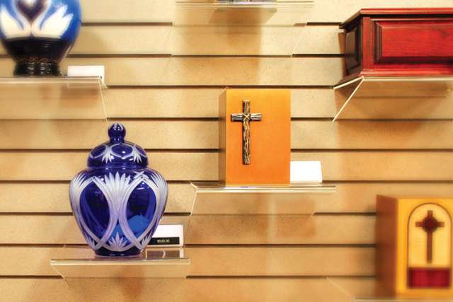 A selection of urns are seen on display in the mortuary at Queen of Heaven Cemetery in Lafayette, Calif. The Catholic Church allows cremation but it must be carried out in a dignified, reverential manner.
